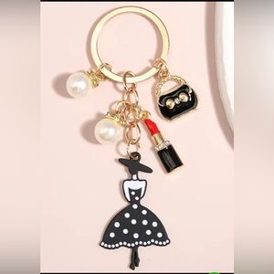 Chic Polka Dot Dress Keychain with Luxurious Vintage Charms.